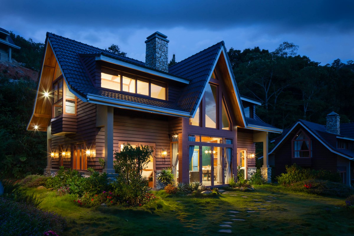 A suburban home lit up at dusk, protected by a home security system