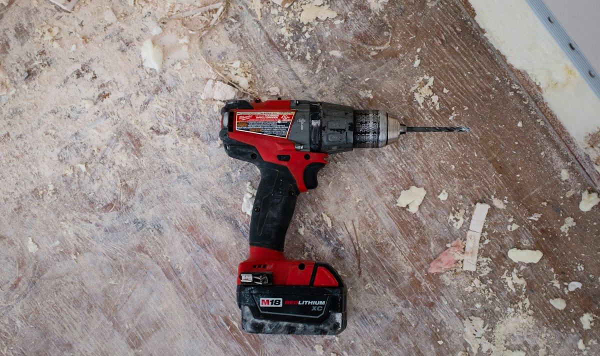 A cordless drill on a work surface during an installation